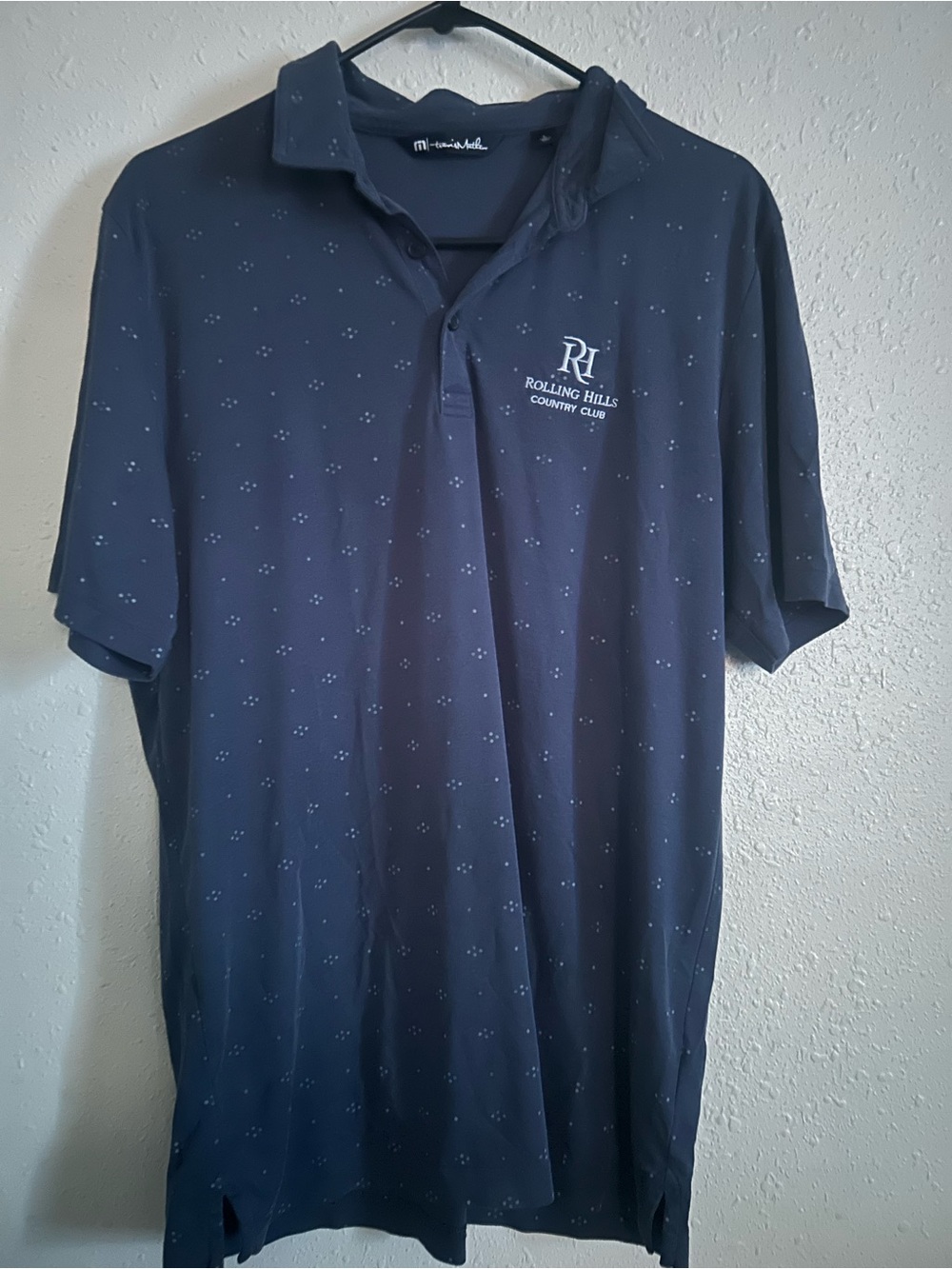 Travis Mathew Navy Polo with Rolling Hills Chest Embroidery
